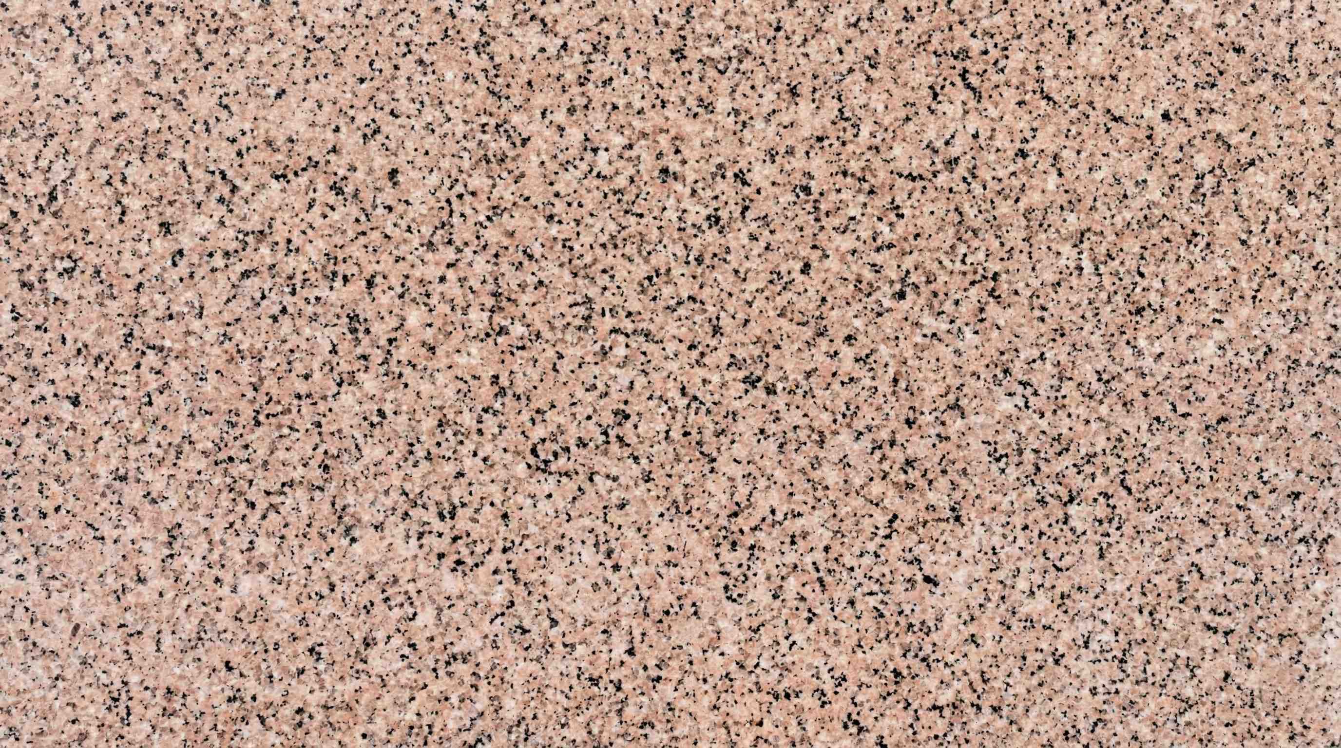 Premium Rosy Pink Indian Granite featuring a delightful and warm embrace of blush and rose tones. High-quality polished slab supplied wholesale in Kishangarh.