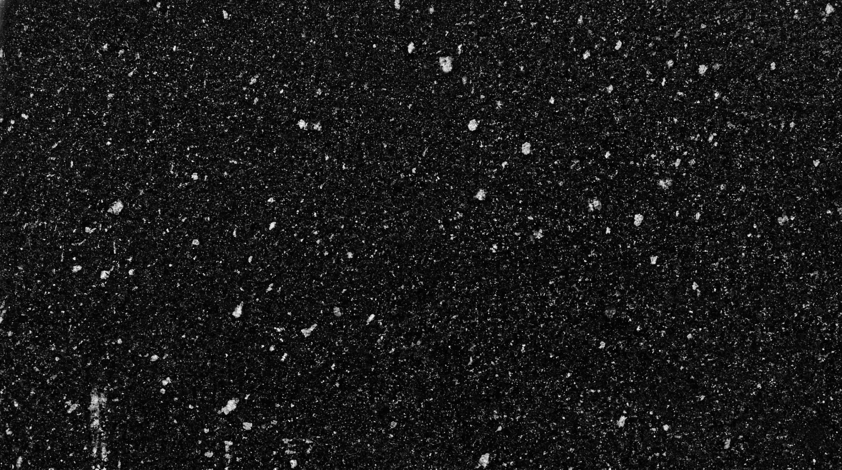 Premium Star Black Indian Granite featuring brilliant, tiny metallic flecks sparkling against a pitch-black background. High-quality polished slab supplied wholesale in Kishangarh.