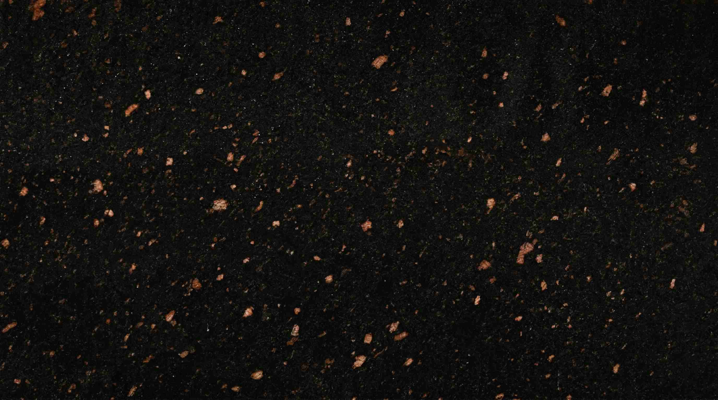 Premium Tan Brown Dark Indian Granite featuring a rich, sophisticated tapestry of dark cocoa and black. High-quality polished slab supplied wholesale in Kishangarh.